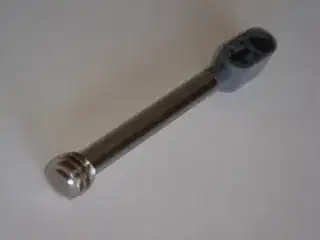 closeup view of the metallic worm gear on the end of the shaft