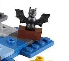 Bat on top of a coffin