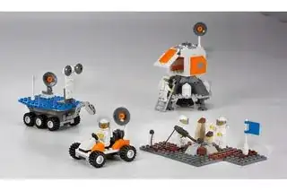 Official LEGO image of the space elements in this set, including a Mars rover, Lunar rover, Lunar lander, and a Lunar surface with two astronauts taking samples