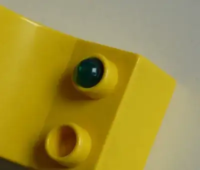 Light bulb stuck in Duplo stud