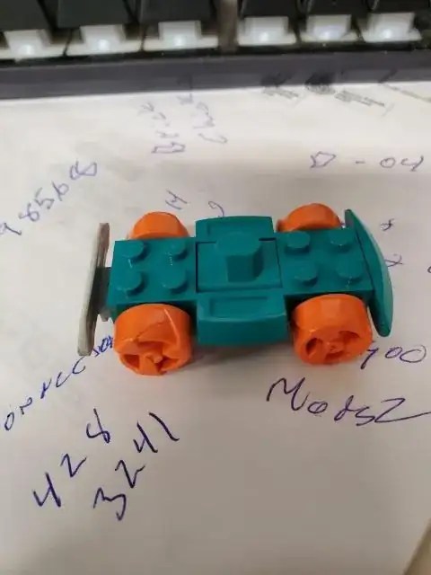 wheels orange, body - green, bumper - gray on 1 end & gray on the other end