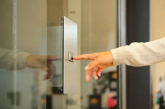 A women pressing a lift call button