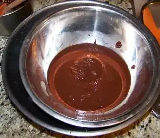 Melted chocolate/coconut milk mixture in ice bath - still hot