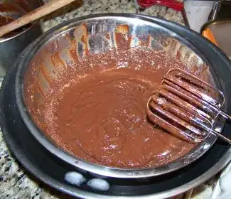 Melted chocolate/coconut milk mixture in ice bath - warm