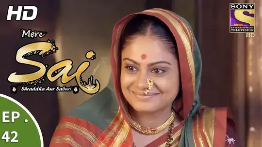 the same lady, smiling