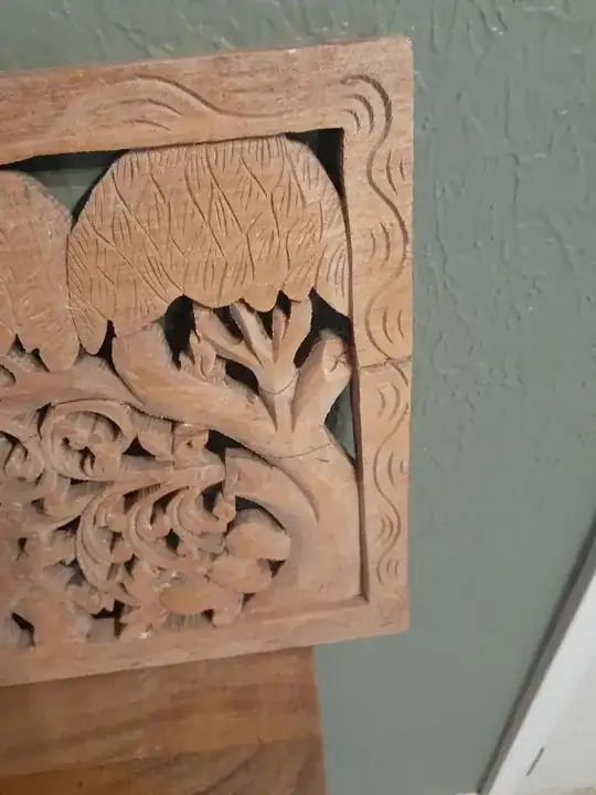 carved wood panel cracks