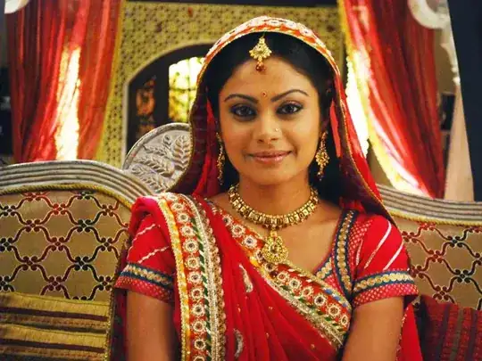 the same lady, smiling