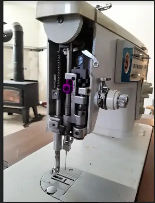 Singer sewing machine without cover, needle end