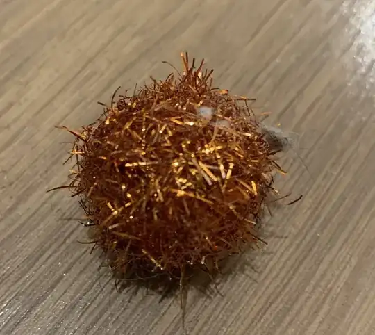 Fuzzy craft ball with shiny, glimmery ribbons roughly 3/4" in diameter