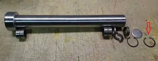 Photo of tube accompanied by partially open rings