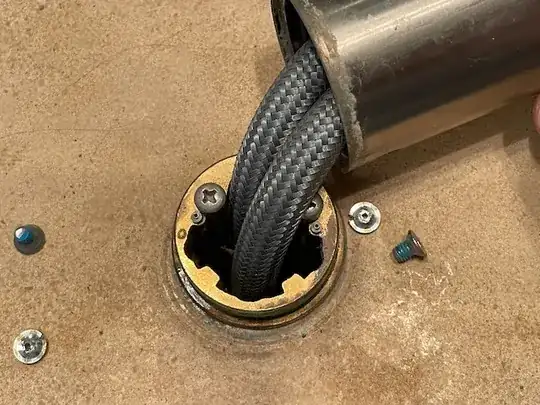 base with exposed screw heads