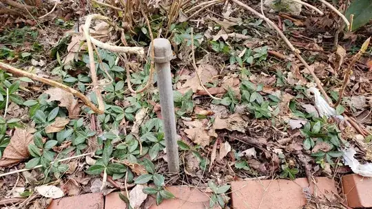 capped off metal pipe, no hand visible