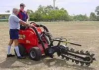 dingo trencher and 4-1 bucket