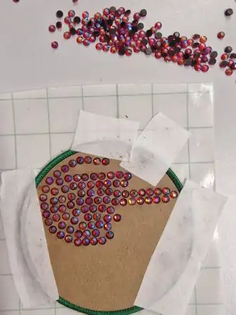 Brushed stones into the holes. Ready to go in the heat press