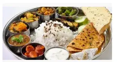 picture of a dish holding several small bowls of food arranged around some rice