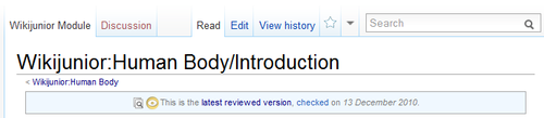 Full bar across screen with a magnifying glass over papers and a yellow eye stating "This is the latest reviewed version, checked on 13 December 2010".