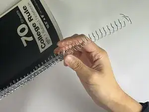 How to Fix a Bent Spiral Coil & Reinforce Torn Holes on a Notebook