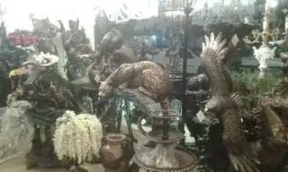 the inside of a shop selling many animal statues