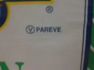 picture of a kosher symbol on a package, with a "V" inside an "O," similar to the OU kosher symbol