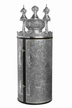 Silver-covered cylinder with two hooks along one side that, when opened, allow it to be opened up around hinges that run up and down the other side