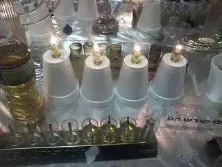 Overturned sytofoam cups with the bottoms of glass oil-cups poked into them