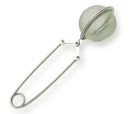 A tea infuser - two hemispheres of metal mesh that fasten together with loose tea inside