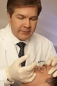 Botulinum toxin being injected in the human face