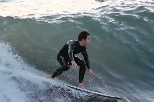 Surfer from pier