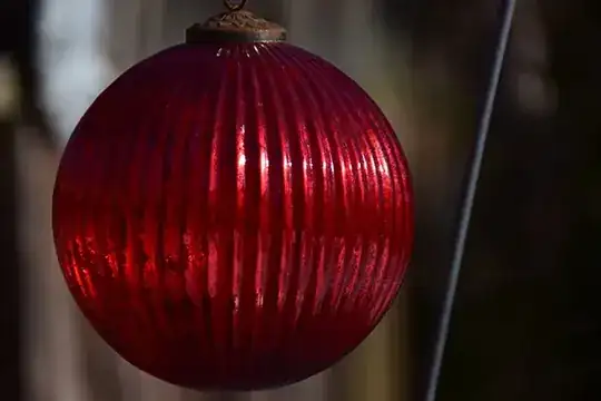 Dark but begins to show depth; doesn't capture the brilliance of the light striking the ball, though