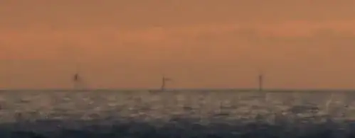 3 windmills on the horizon