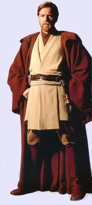 Image of actor Ewan Mcgregor dressed up as "Obi Wan Kenobi" from the Star Wars franchise, displaying his Lightsaber.