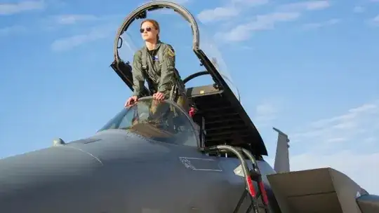 Carol Danvers standing in plane cockpit