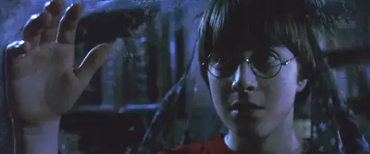 (Notice the books behind Harry, and how folds are clearly visible)