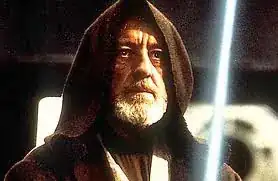 Obi-Wan Kenobi faces Vader with his lightsaber held in front. The cowl of his robe is over his head.