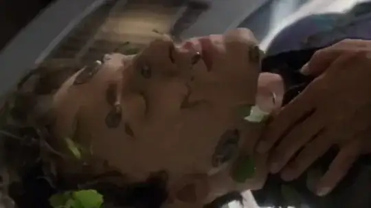 An Enterprise crewmember with leaves, ricks, and sticks embedded in their skin
