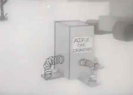 Gray box with springs on the side, with the label "Ajax Car Crusher"