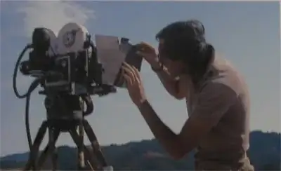 an artist sets up the camera