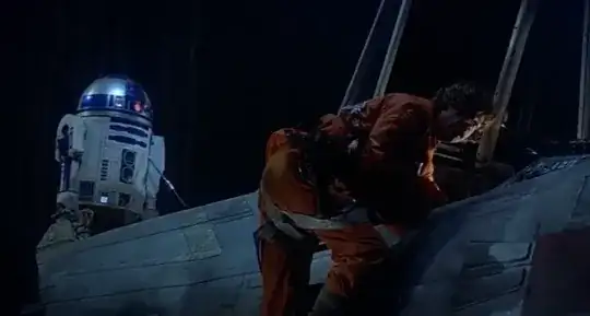 R2-D2 on top of Luke’s X-Wing with some kind of cable attached to him.