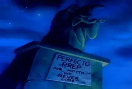 A statue visible against a night sky. The pedestal of the statue says "Perfecto Prep. Our motto "We never lose""