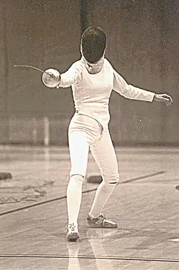 foil with hand extended for balance