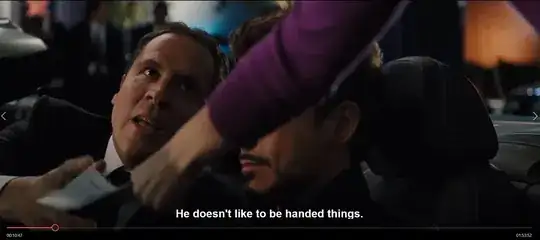 The Marshal's arm leans into the car and across Tony who is driving to Happy who is reaching up to grab the summons