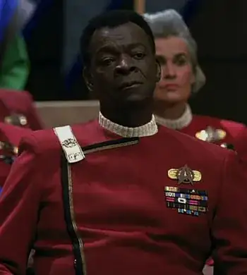 Admiral Cartwright, wearing a Wrath of Khan-style admiral's uniform
