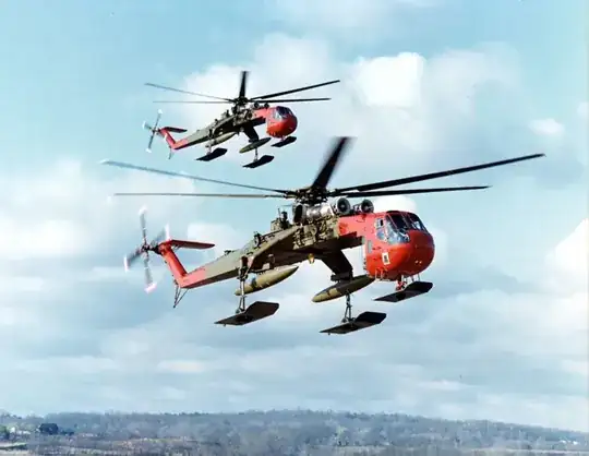 Photo of two unladen Sikorsky CH-54 helicopters in flight