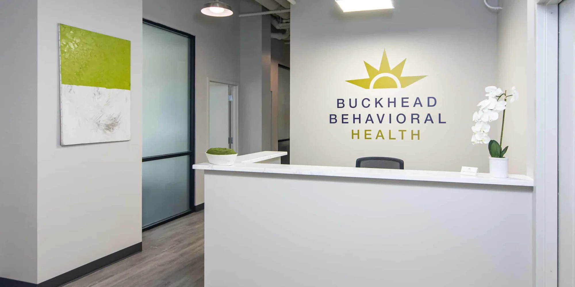 A reception desk at Buckhead Behavioral Health with modern decor.
