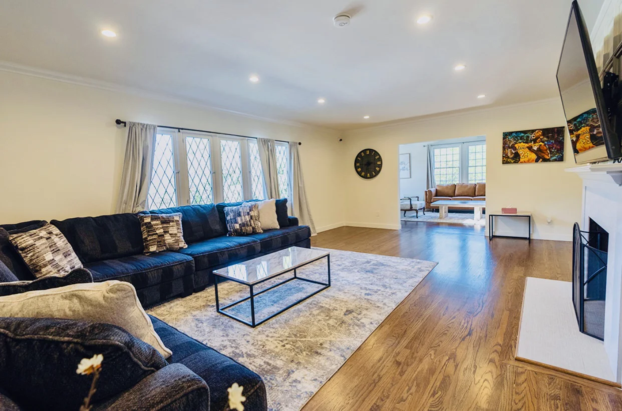 Lving room with a sectional sofa and TV.