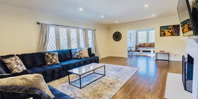 Lving room with a sectional sofa and TV.