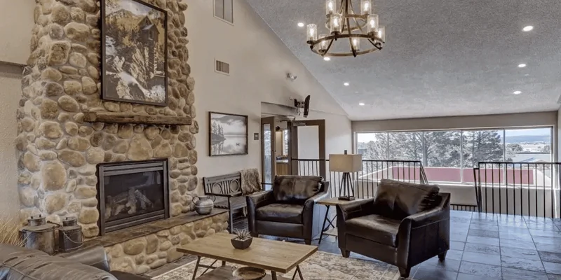 Lounge with  seating, and a fireplace.