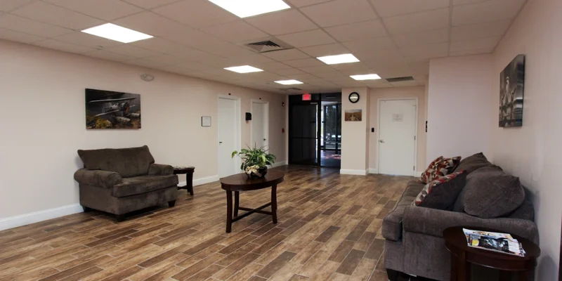 Open lobby area with sofas and tables.