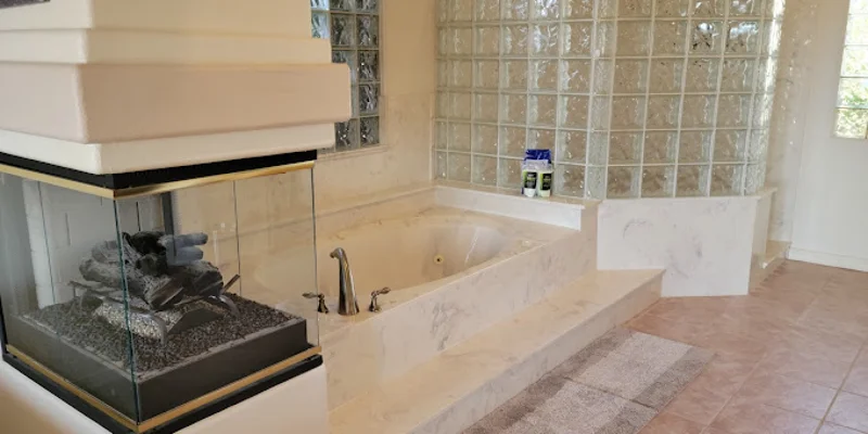 Bathroom with stylish tiles, fixtures, and a walk-n shower.