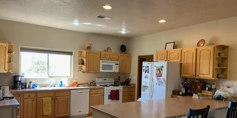 Commercial-style kitchen with a large island and seating.